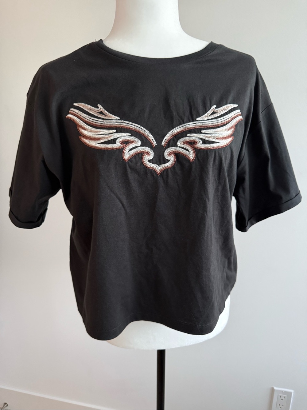 New with Tags Black Short Sleeve Tee with Embroidered Wing Motif